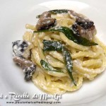 Pasta con funghi e ricotta al profumo di rucola